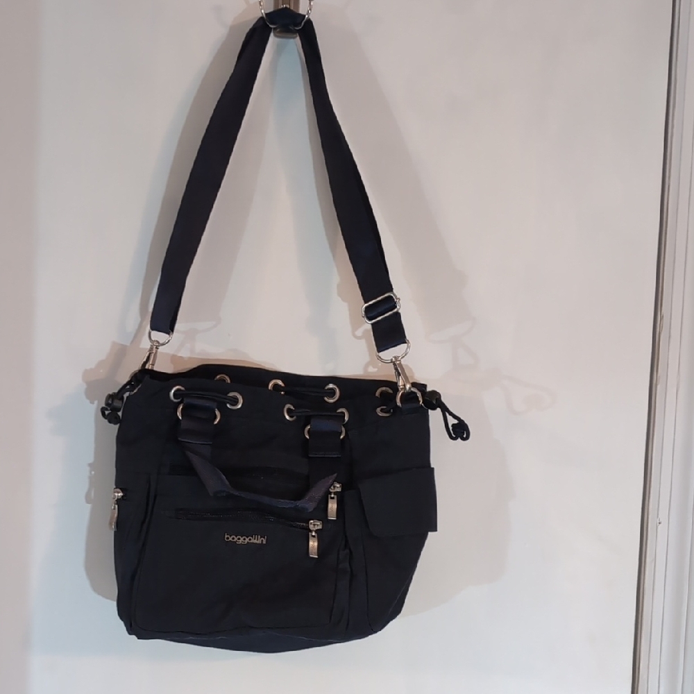 Black Shoulder Bag with Adjustable Strap and Zipper Closures